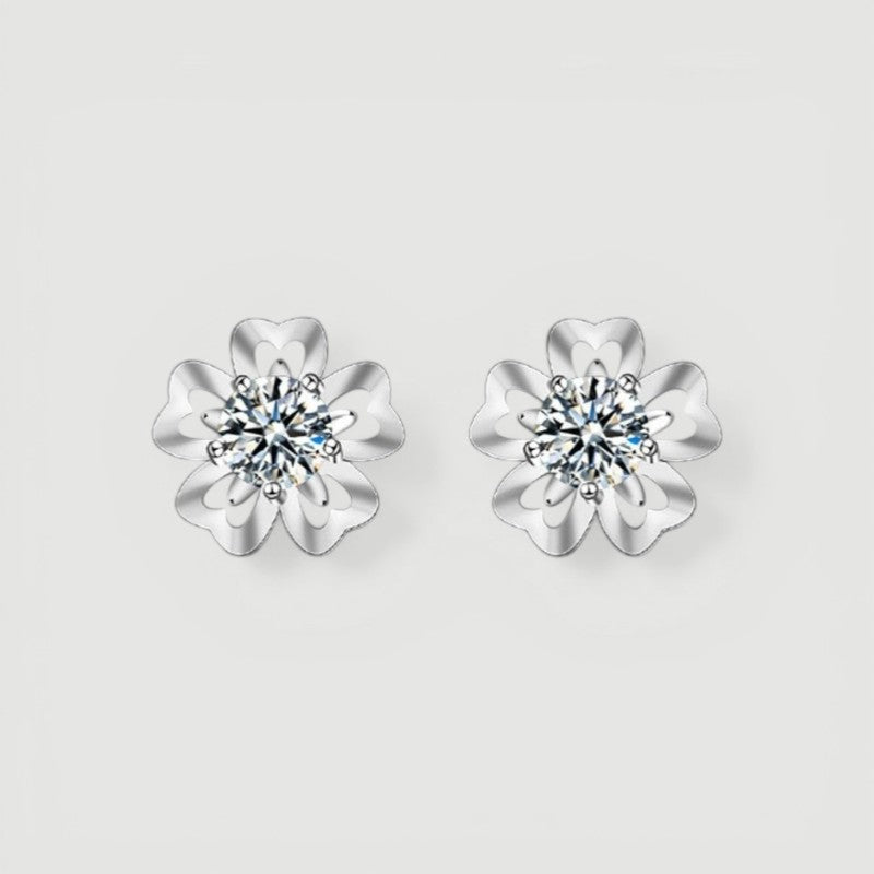 Amara Jewels sterling silver flower petal stud earrings with a central round stone, symbolizing love and elegance.