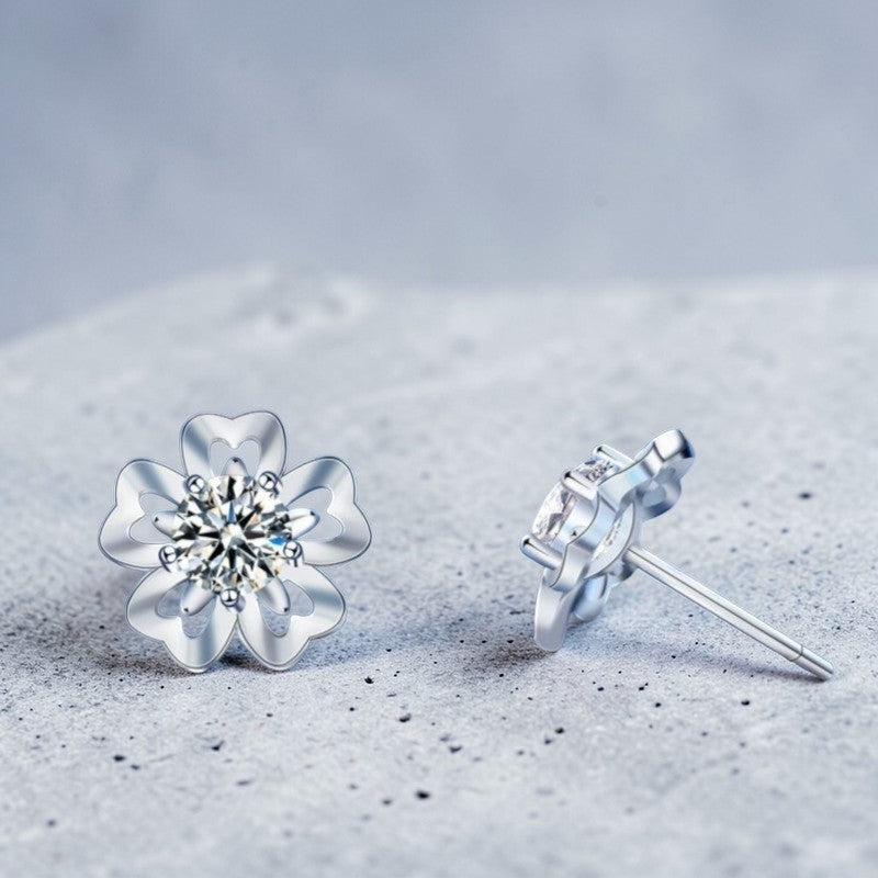Amara Jewels sterling silver flower petal stud earrings with a central round stone, symbolizing love and elegance.