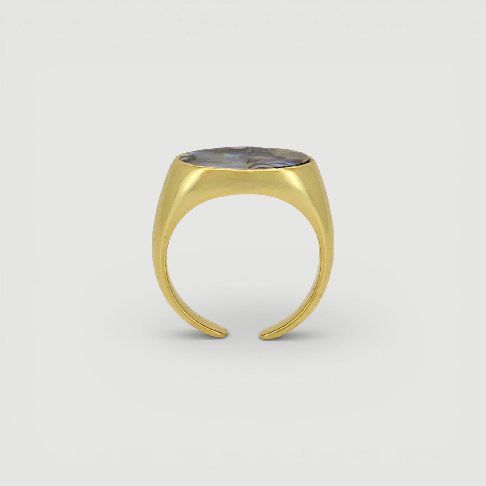 Amara Jewels gold-tone open ring with oval abalone shell inlay featuring iridescent blues, greens, and purples.