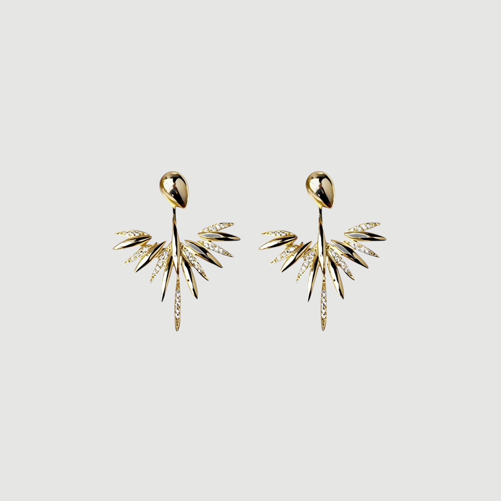 Amara Jewels 18K gold plated sterling silver leaf dangle earrings with sparkling cubic zirconia accents.
