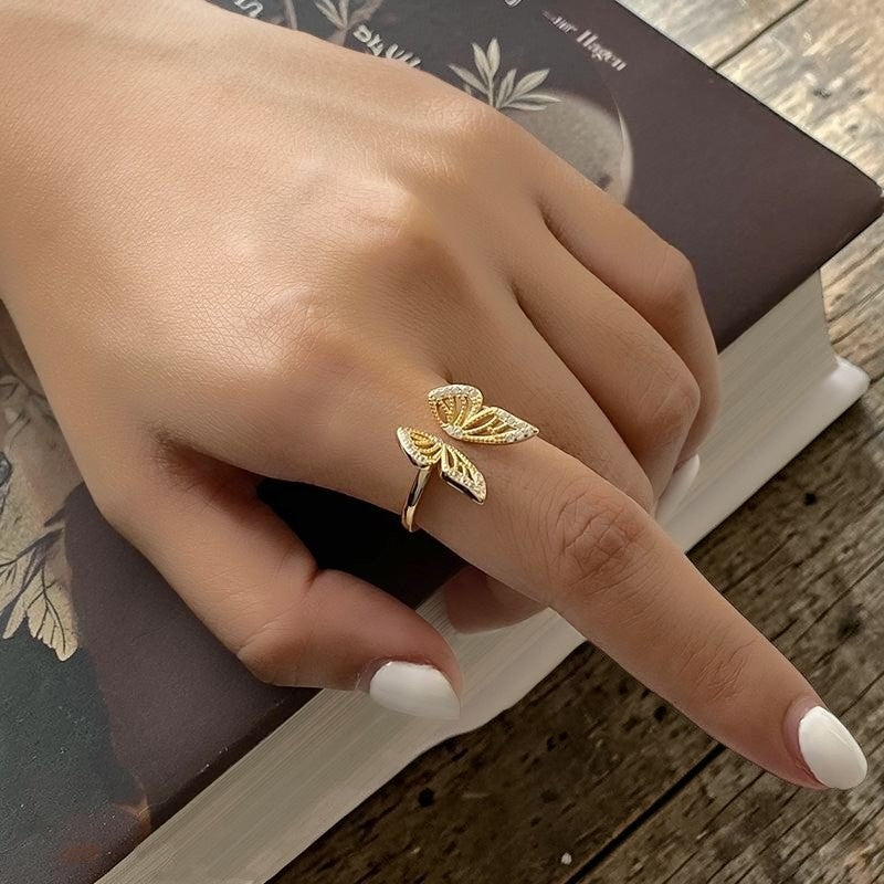 Amara Jewels gold-plated 925 sterling silver open ring with intricate butterfly design and shimmering accents.