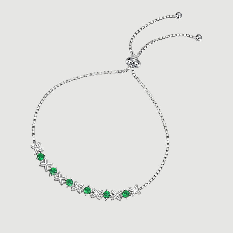 Amara Jewels sterling silver bracelet with green gemstones set in a flower design. Adjustable slider clasp.