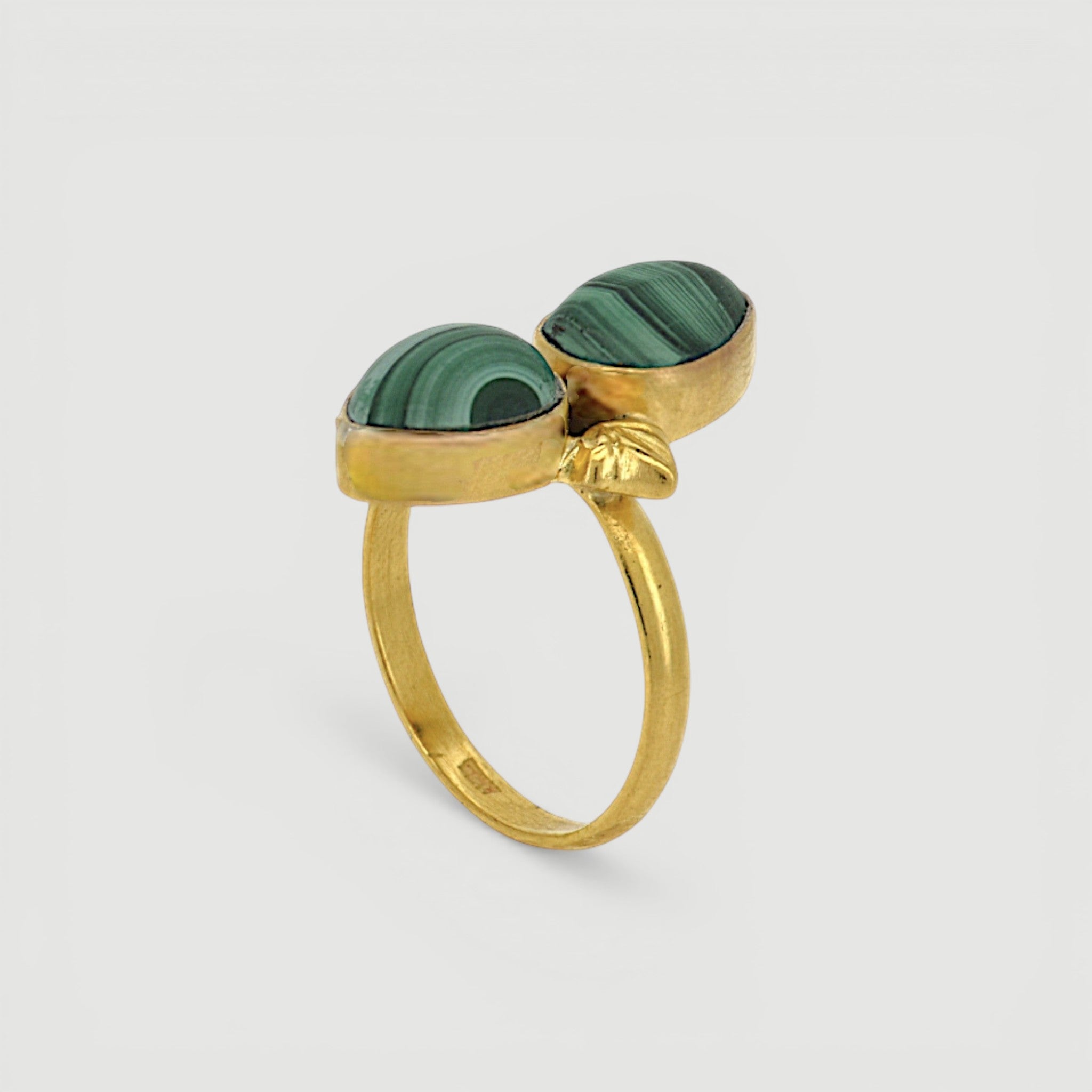 Amara Jewels green malachite statement ring in 18K gold vermeil over sterling silver. Features natural malachite gemstone with unique banding patterns.