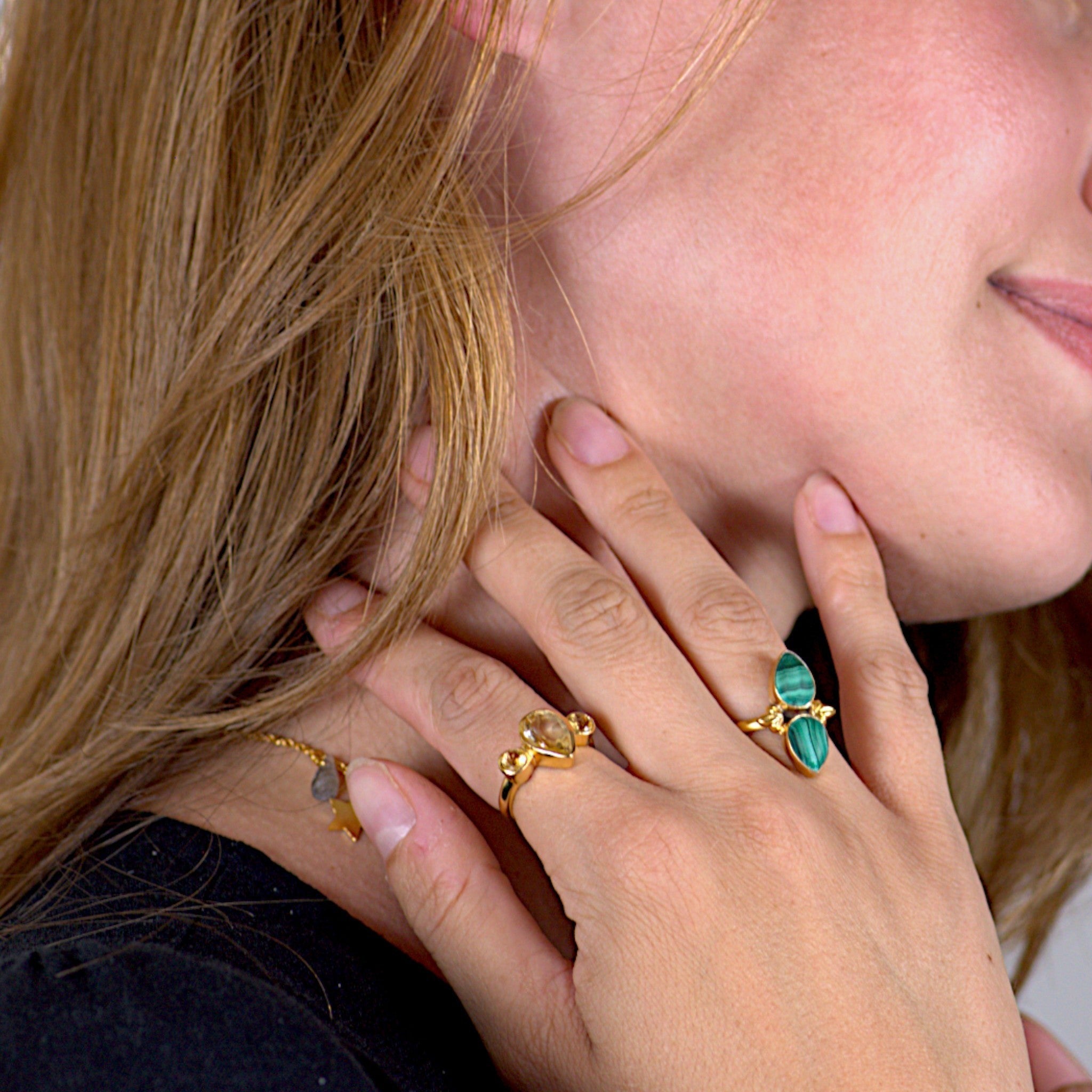 Amara Jewels green malachite statement ring in 18K gold vermeil over sterling silver. Features natural malachite gemstone with unique banding patterns.