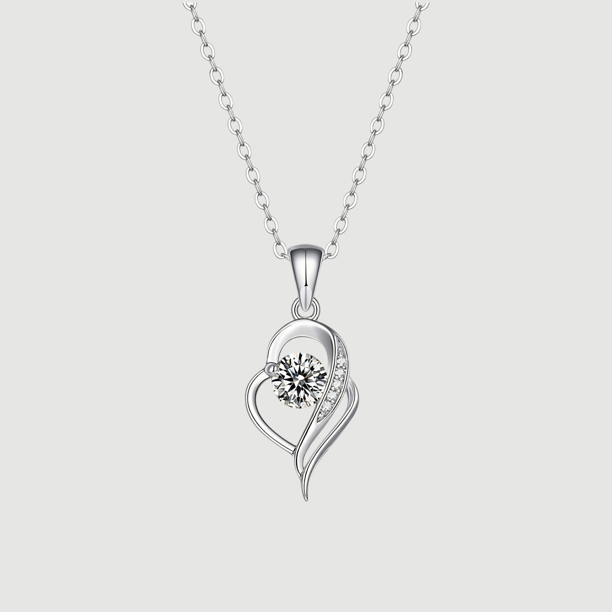 Amara Jewels sterling silver necklace with an irregular heart pendant featuring a cubic zirconia and accent stones.