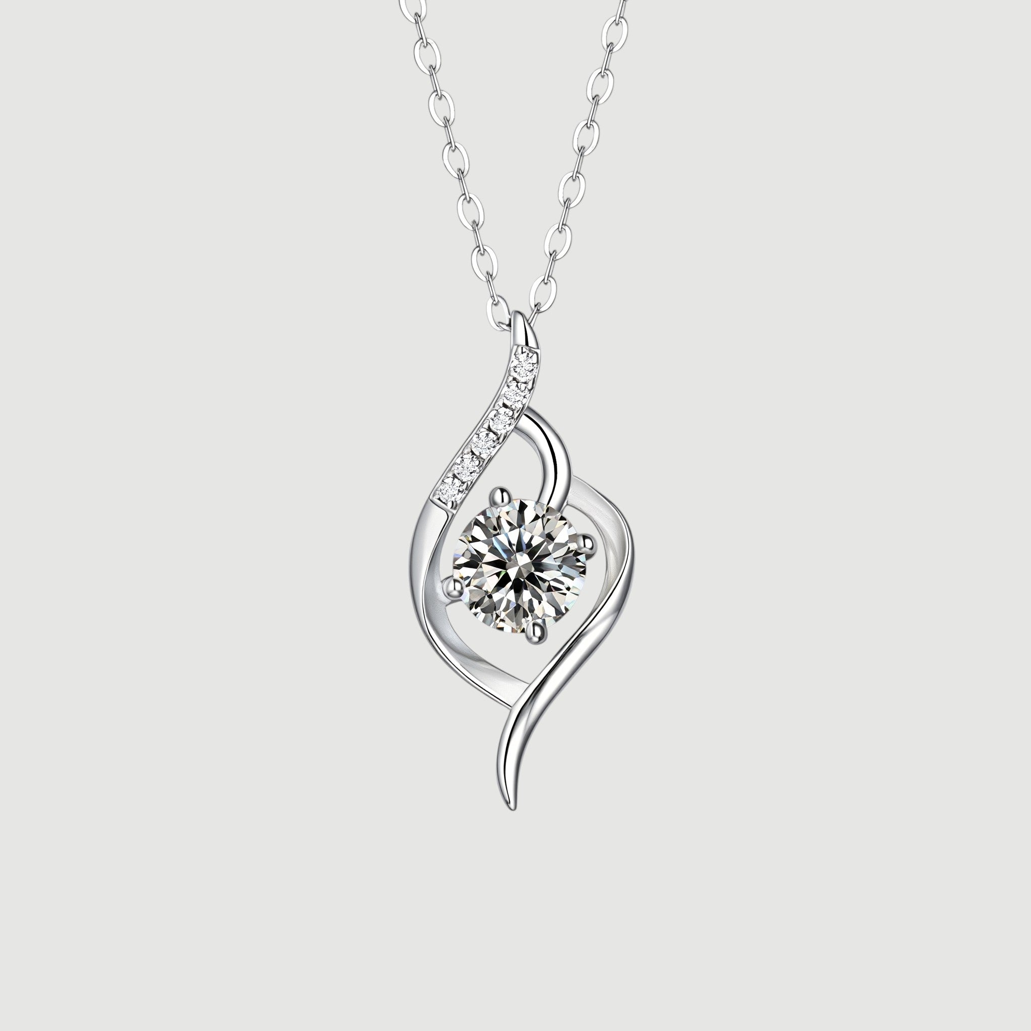Amara Jewels Sterling Silver Infinity Twirl Pendant Necklace with round-cut crystal and small accent stones.