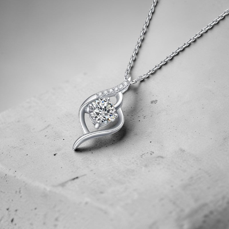 Amara Jewels Sterling Silver Infinity Twirl Pendant Necklace with round-cut crystal and small accent stones.