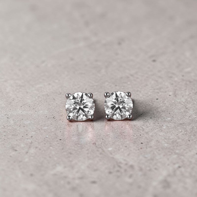 Amara Jewels sterling silver round-cut cubic zirconia Moissanite stud earrings with four-prong setting.