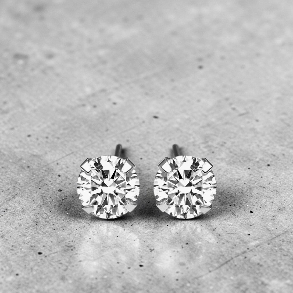 Amara Jewels sterling silver round-cut cubic zirconia Moissanite stud earrings with four-prong setting.