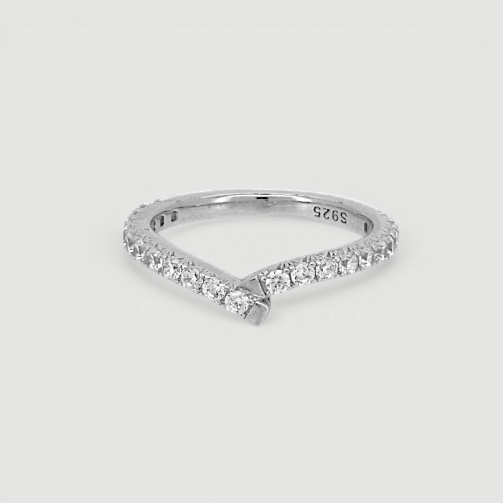 Amara Jewels V-shape ring with pavé-set cubic zirconia stones on a slim sterling silver band.