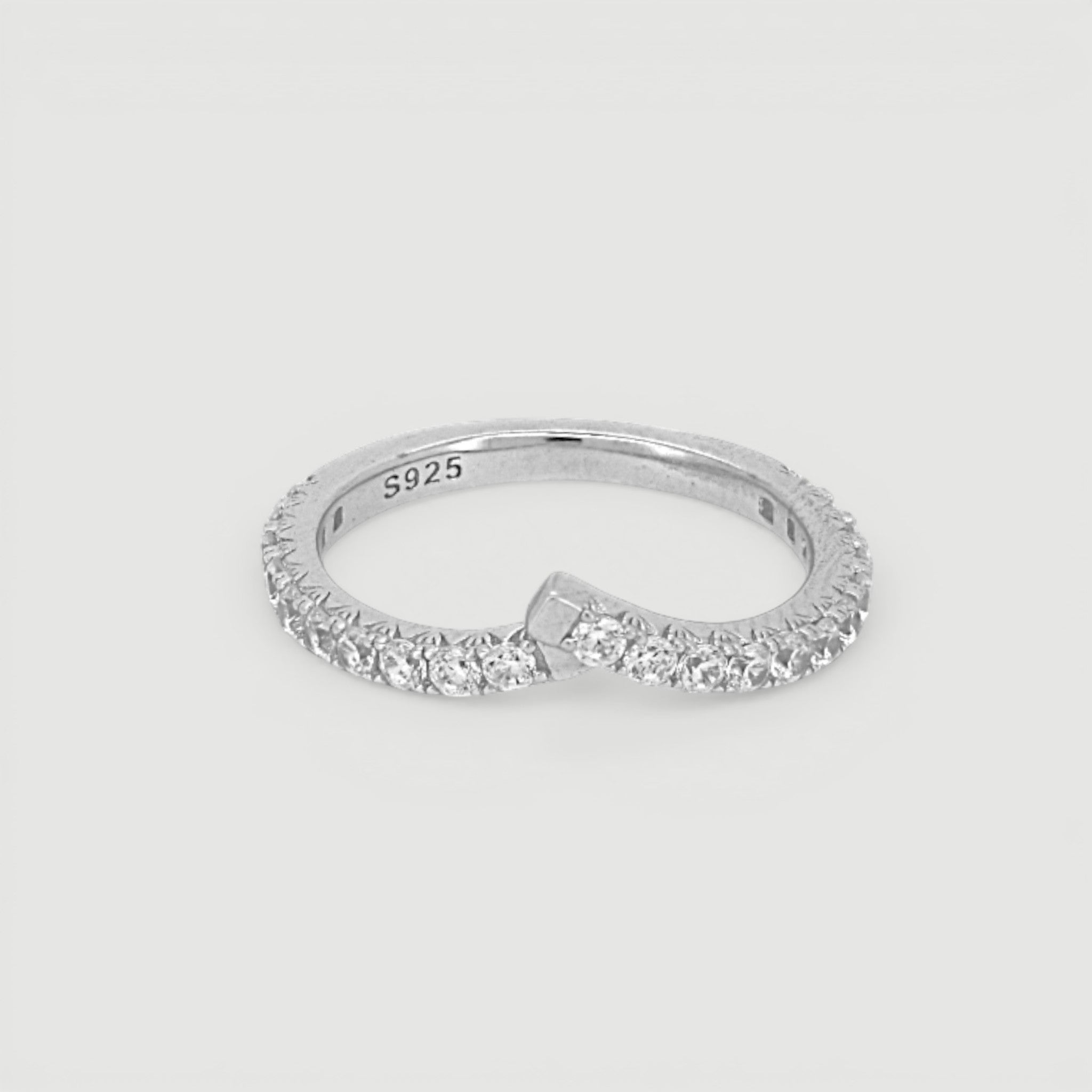 Amara Jewels V-shape ring with pavé-set cubic zirconia stones on a slim sterling silver band.