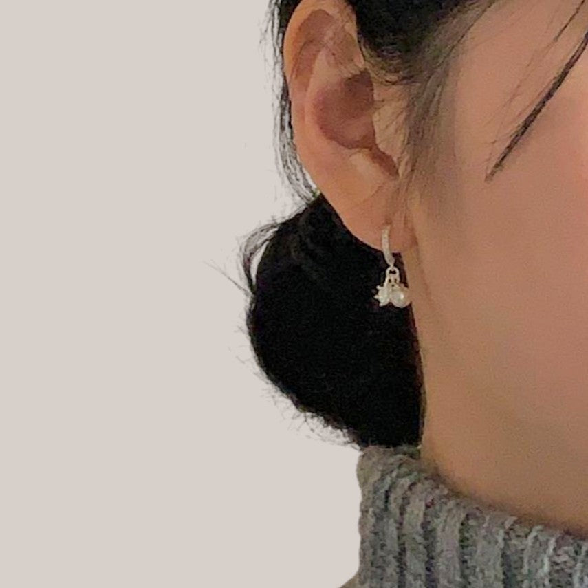 Amara Jewels sterling silver dangle earrings with pearl and crystal snowflake charms.