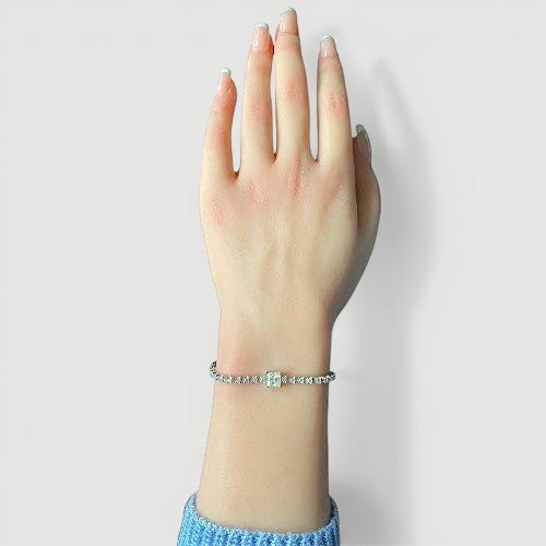 Amara Jewels 925 sterling silver tennis bracelet with princess-cut zirconia centerpiece and round-cut stones.