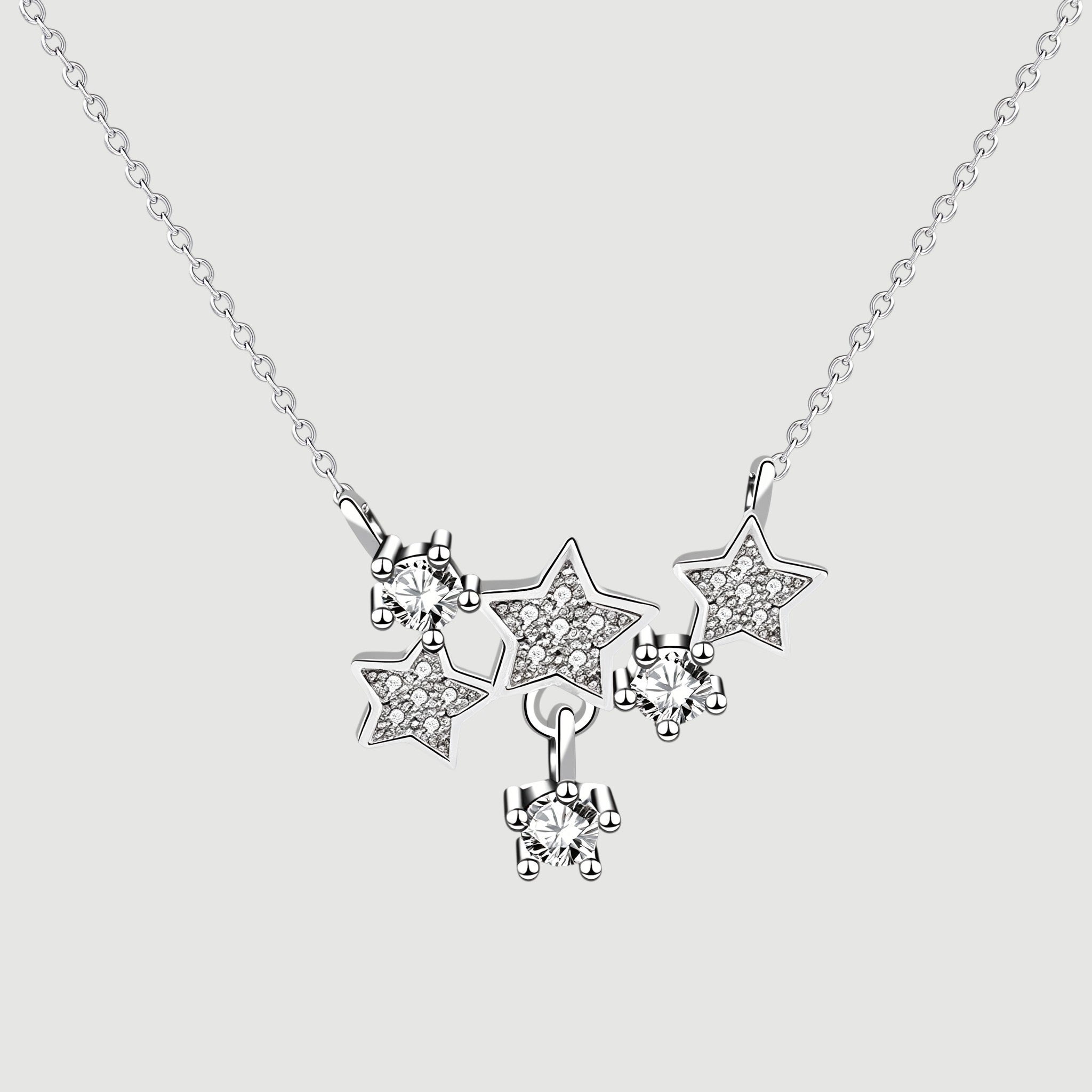 Amara Jewels sterling silver necklace with a cluster of sparkling star pendants adorned with crystals.