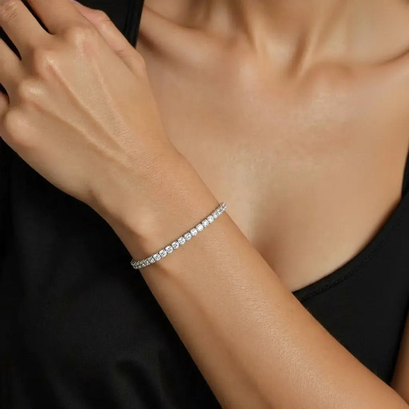 Amara Jewels classic tennis bracelet with white-plated sterling silver and sparkling stones, adjustable clasp.