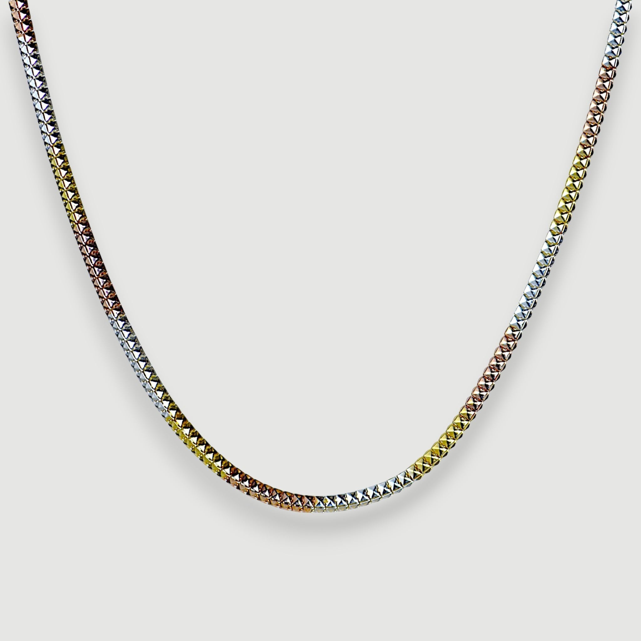 Amara Jewels Tricolor Italian chain necklace in sterling silver with diamond-cut texture, featuring silver, yellow gold, and rose gold tones.