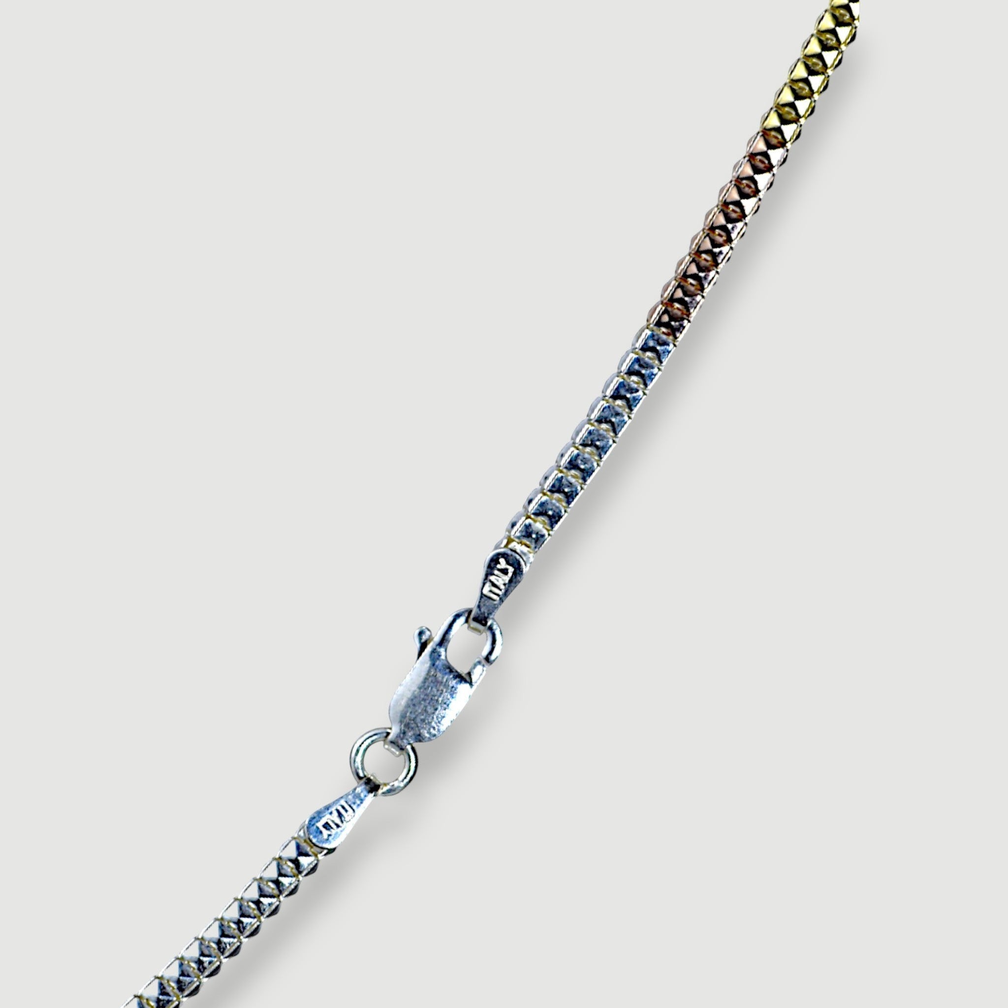 Amara Jewels Tricolor Italian chain necklace in sterling silver with diamond-cut texture, featuring silver, yellow gold, and rose gold tones.