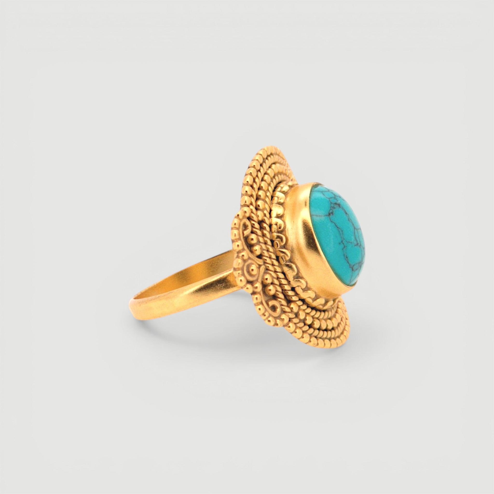 Amara Jewels antique-inspired oval turquoise ring with intricate gold detailing on sterling silver with 18K gold plating.