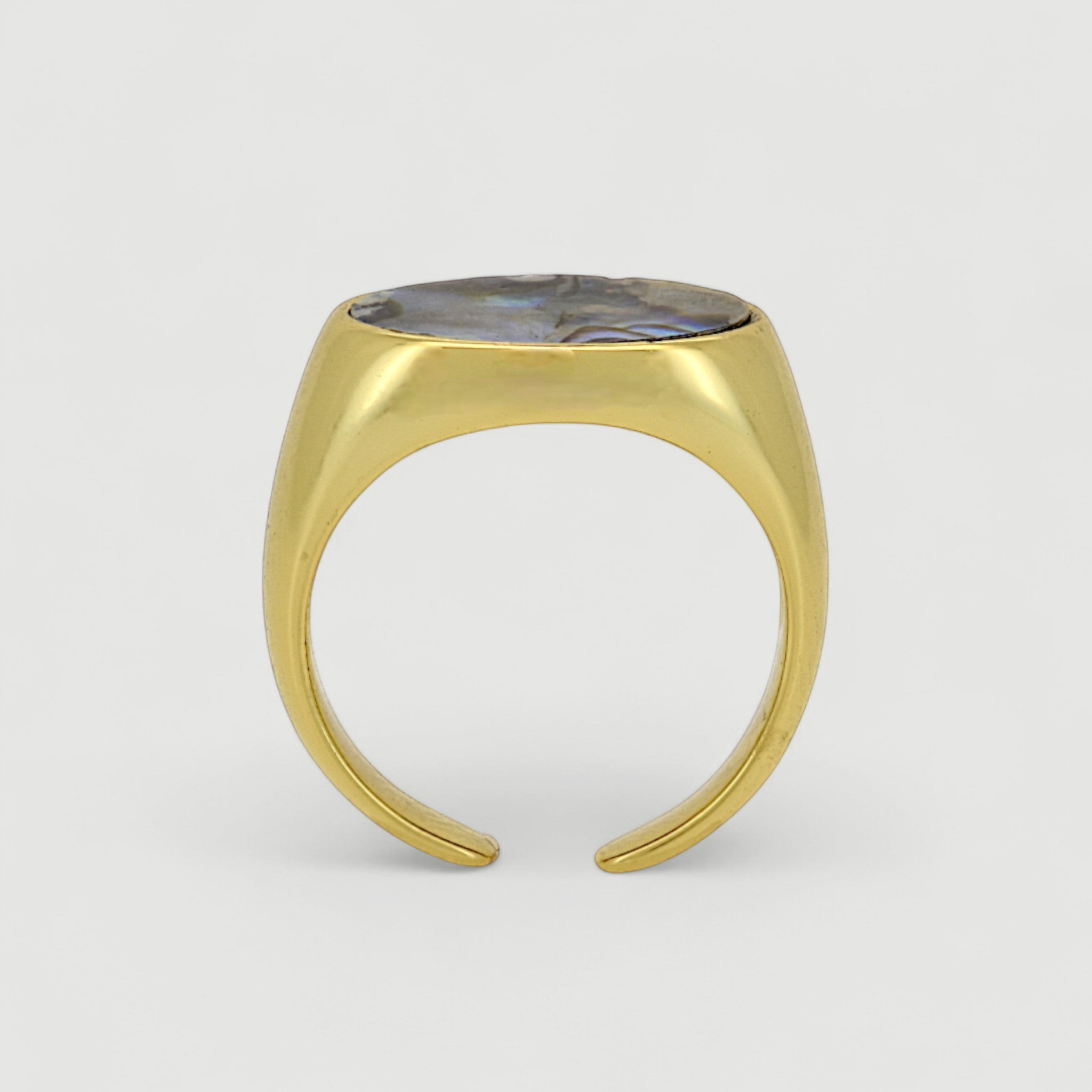 Amara Jewels gold-tone open ring with oval abalone shell inlay featuring iridescent blues, greens, and purples.