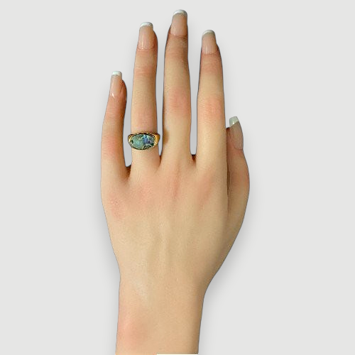 Amara Jewels gold-tone open ring with oval abalone shell inlay featuring iridescent blues, greens, and purples.