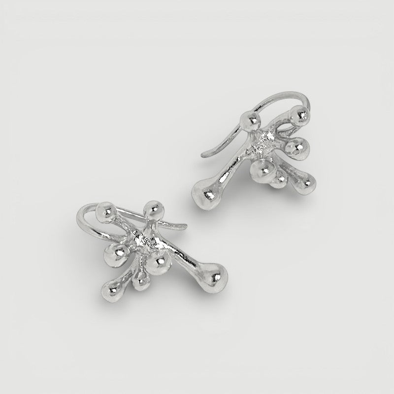Amara Jewels abstract fluid sterling silver earrings with a polished finish, evoking organic movement.