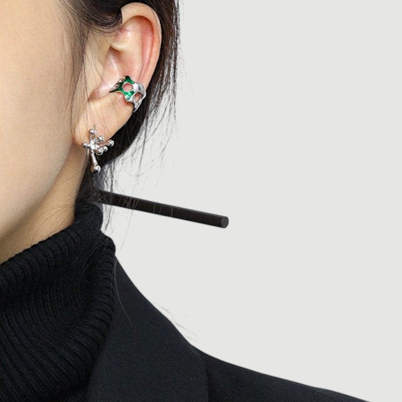 Amara Jewels abstract fluid sterling silver earrings with a polished finish, evoking organic movement.