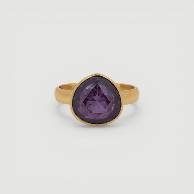Amara Jewels 18K gold vermeil ring with a faceted deep violet amethyst gemstone in a bezel setting.