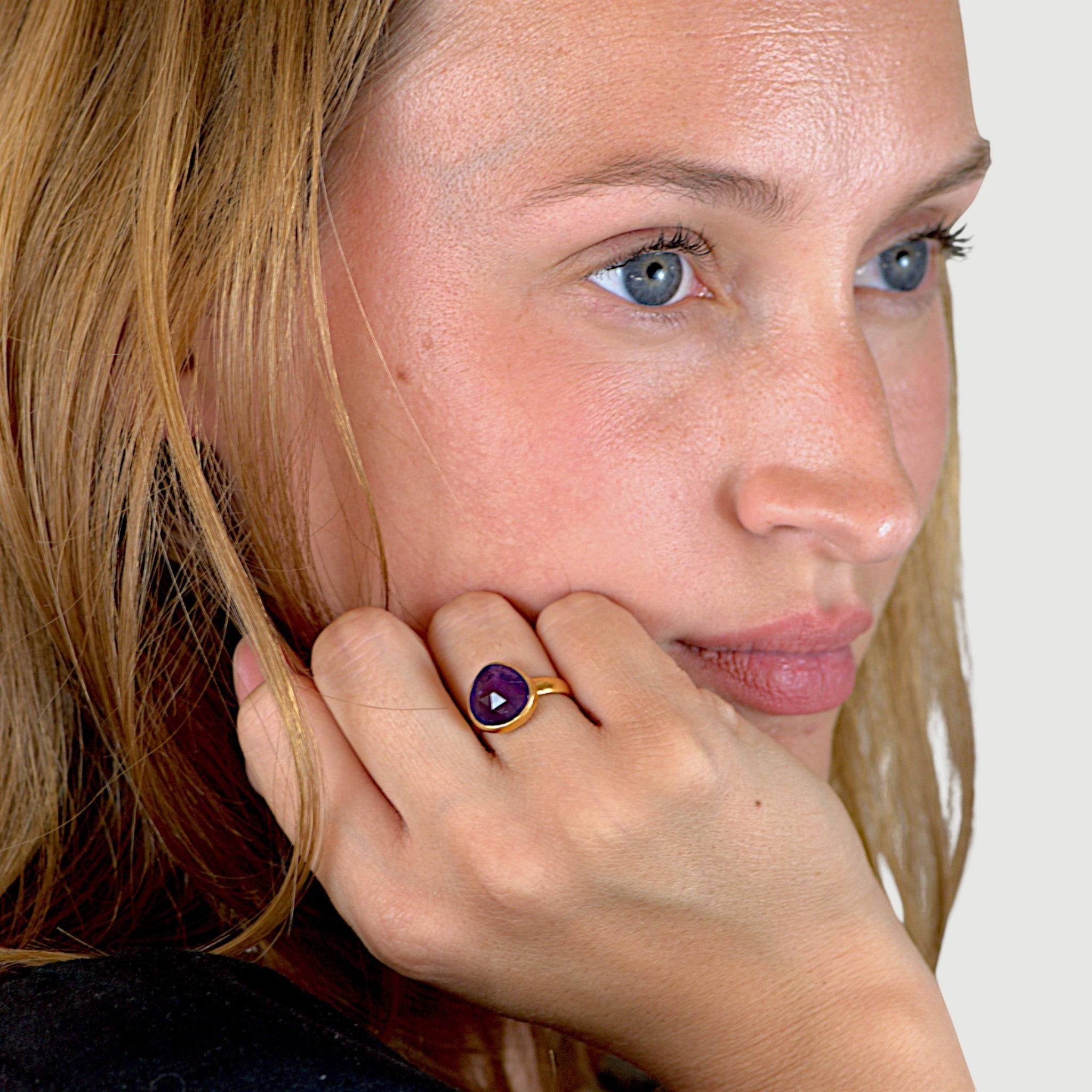 Amara Jewels 18K gold vermeil ring with a faceted deep violet amethyst gemstone in a bezel setting.