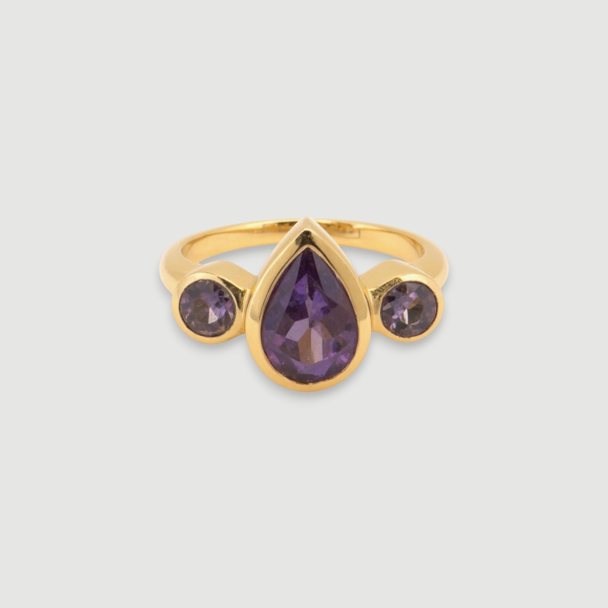 Amara Jewels gold vermeil sterling silver ring with pear-cut and round-cut amethyst gemstones.