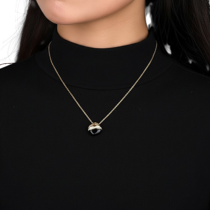 Amara Jewels gold 925 sterling silver necklace with black agate pendant, accented with crystals.