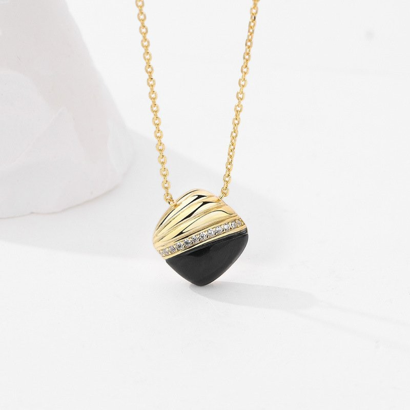 Amara Jewels gold 925 sterling silver necklace with black agate pendant, accented with crystals.