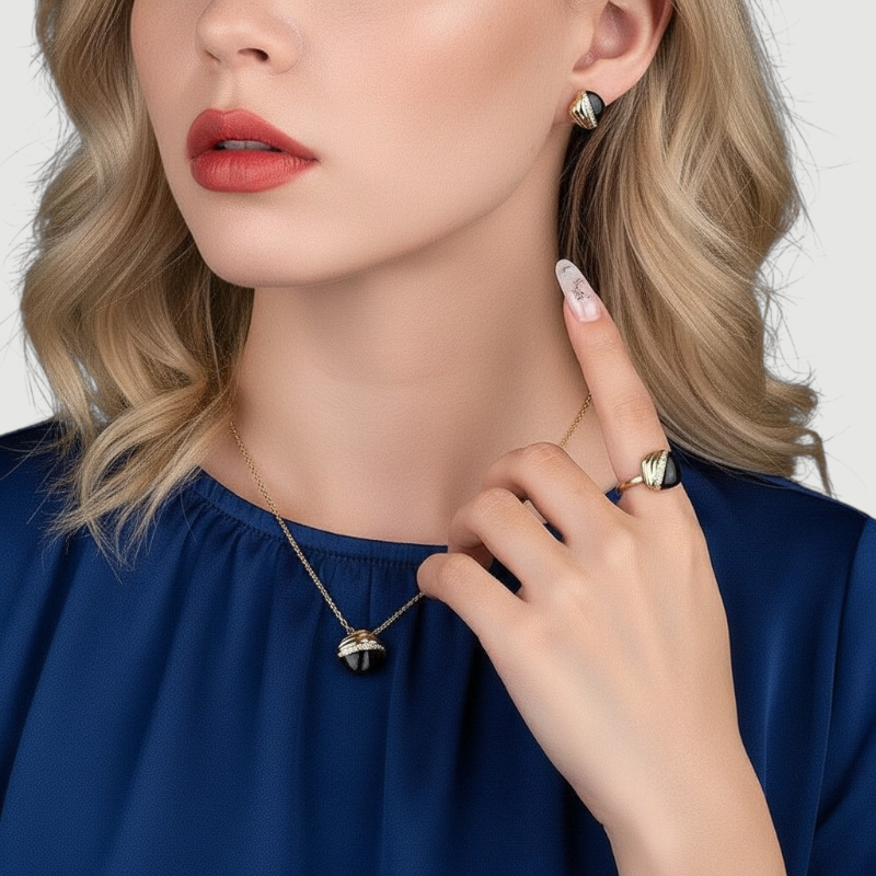 Amara Jewels gold-plated sterling silver stud earrings with black enamel and cubic zirconia accents.