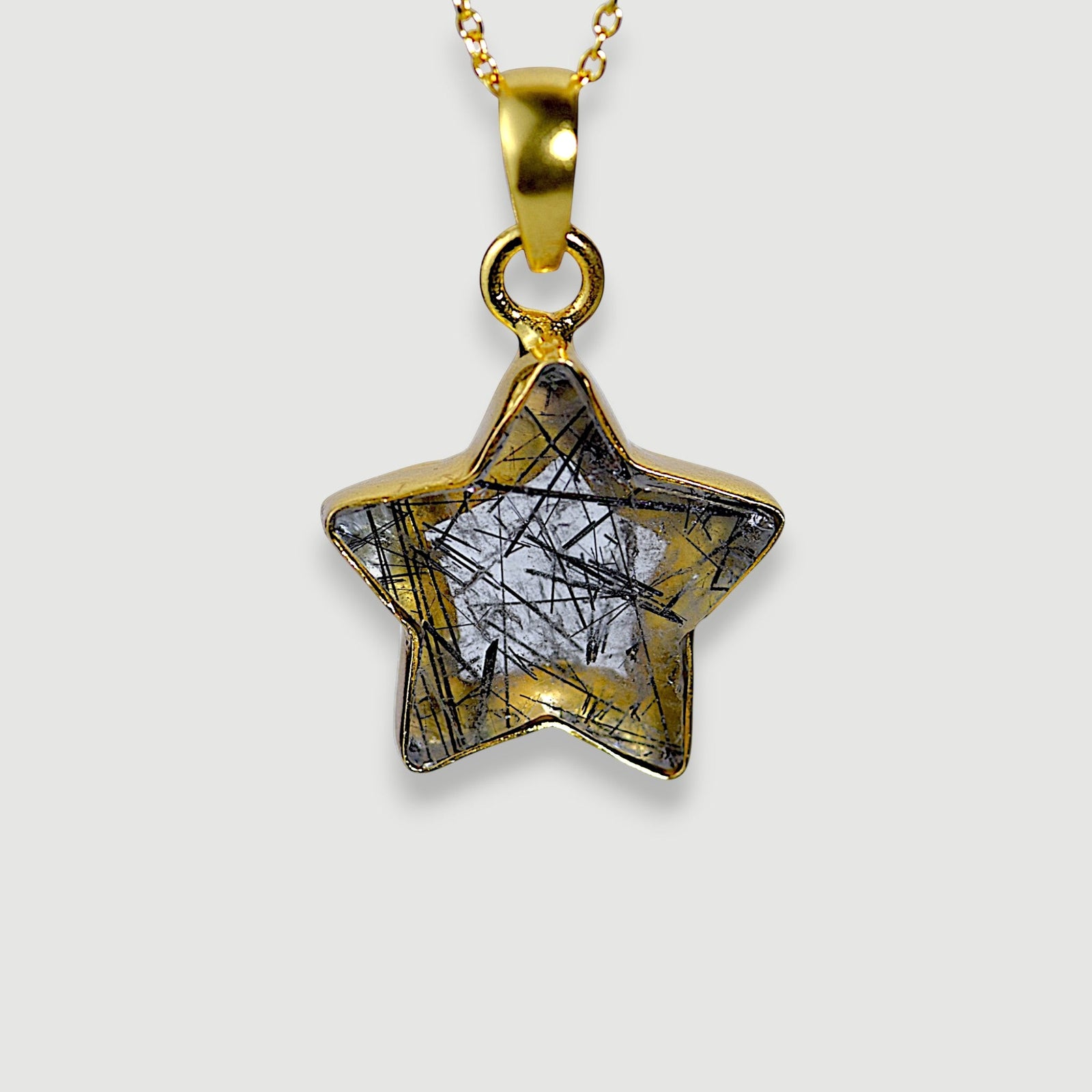 Amara Jewels star pendant necklace with black rutilated quartz and 18K gold vermeil chain.