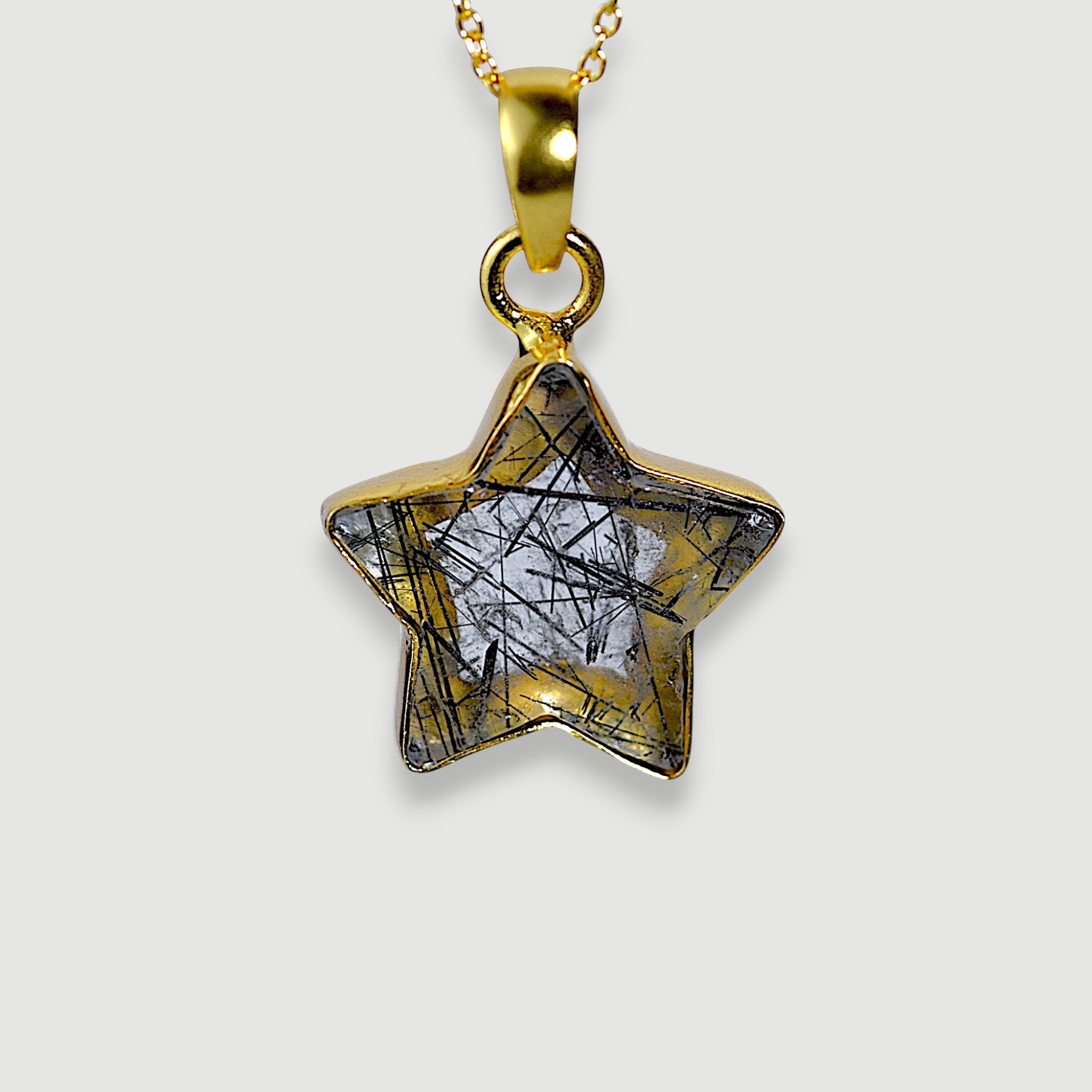 Amara Jewels star pendant necklace with black rutilated quartz and 18K gold vermeil chain.