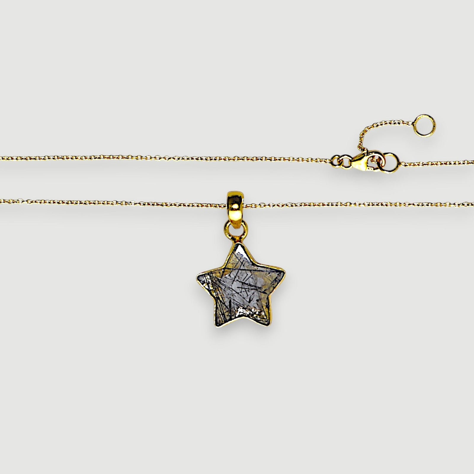 Amara Jewels star pendant necklace with black rutilated quartz and 18K gold vermeil chain.