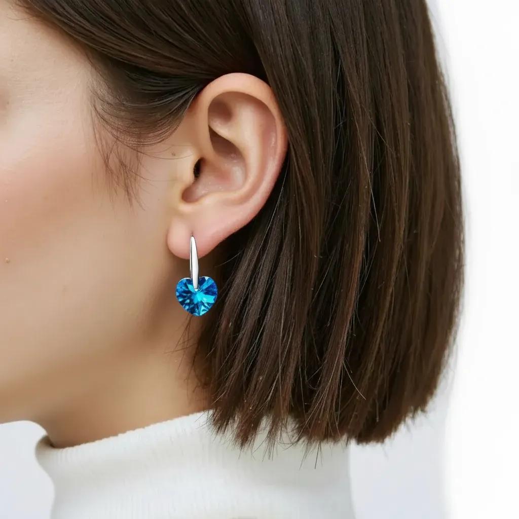 Amara Jewels blue heart-shaped crystal drop earrings with sterling silver hooks.