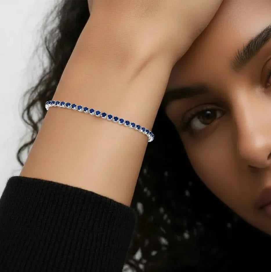 Amara Jewels sterling silver slider bracelet with deep blue sapphires and adjustable chain.