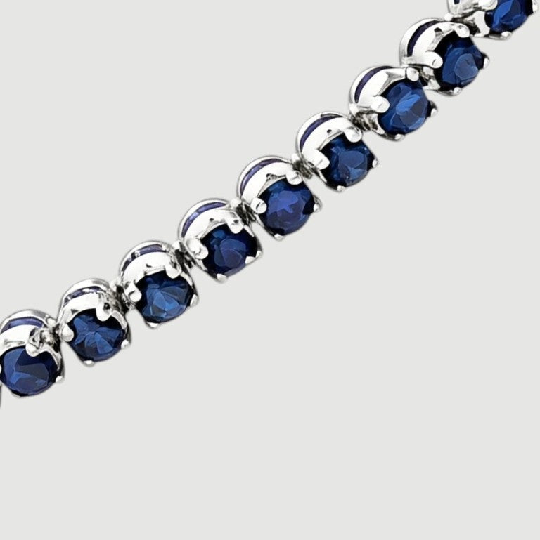 Amara Jewels sterling silver slider bracelet with deep blue sapphires and adjustable chain.
