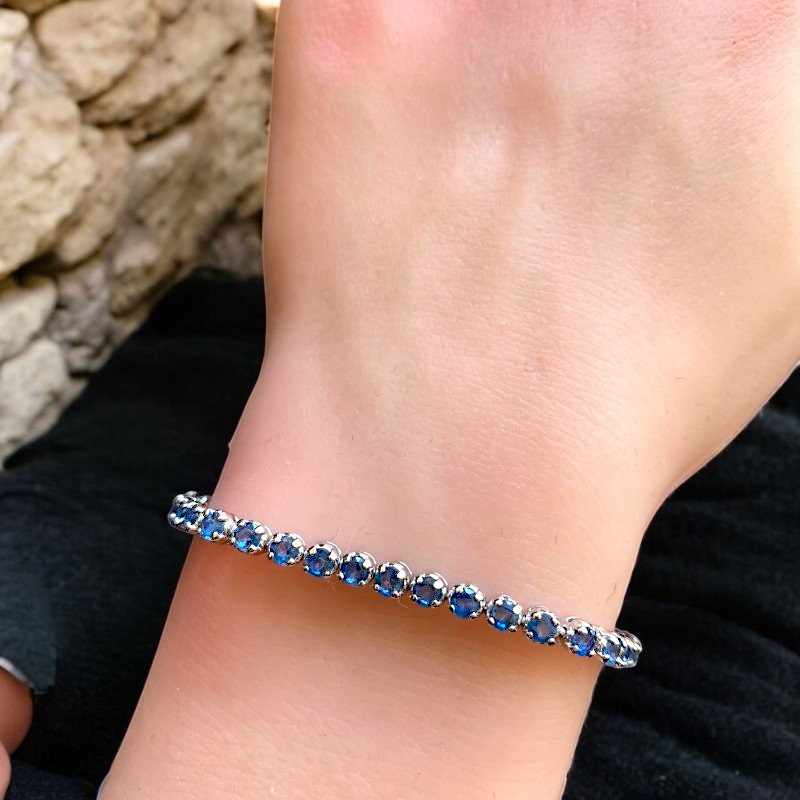 Amara Jewels sterling silver slider bracelet with deep blue sapphires and adjustable chain.