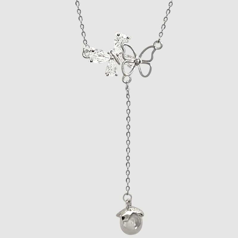 Amara Jewels sterling silver necklace with butterfly pendant adorned with cubic zirconia and an acorn charm.