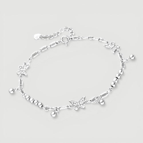 Amara Jewels sterling silver bracelet with delicate butterfly charms and polished silver beads, adjustable clasp.
