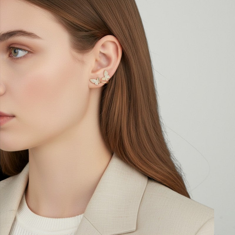 Amara Jewels gold-plated sterling silver climber earrings with cubic zirconia butterflies.