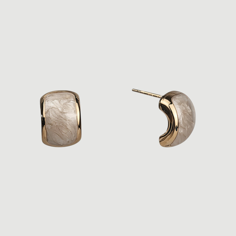 Amara Jewels champagne pearl stud earrings with textured gold plating and half-moon shape.