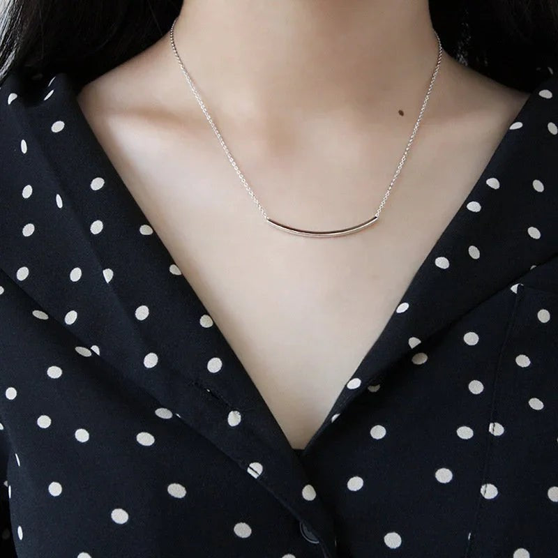 Amara Jewels polished silver 925 sterling silver curved bar necklace, minimalist design.