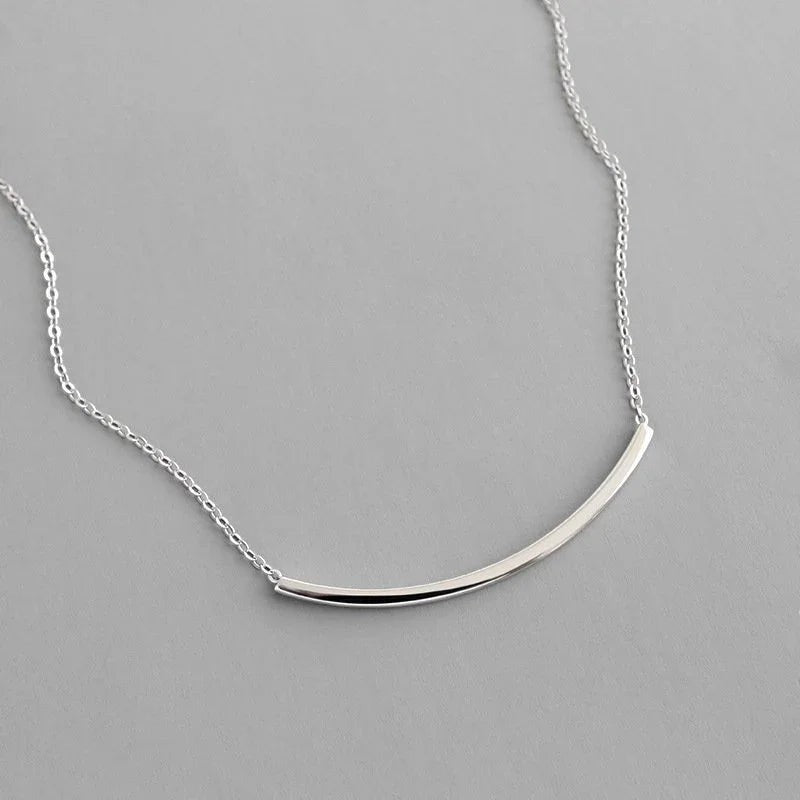 Amara Jewels minimalist 925 sterling silver curved bar necklace with polished silver tone.