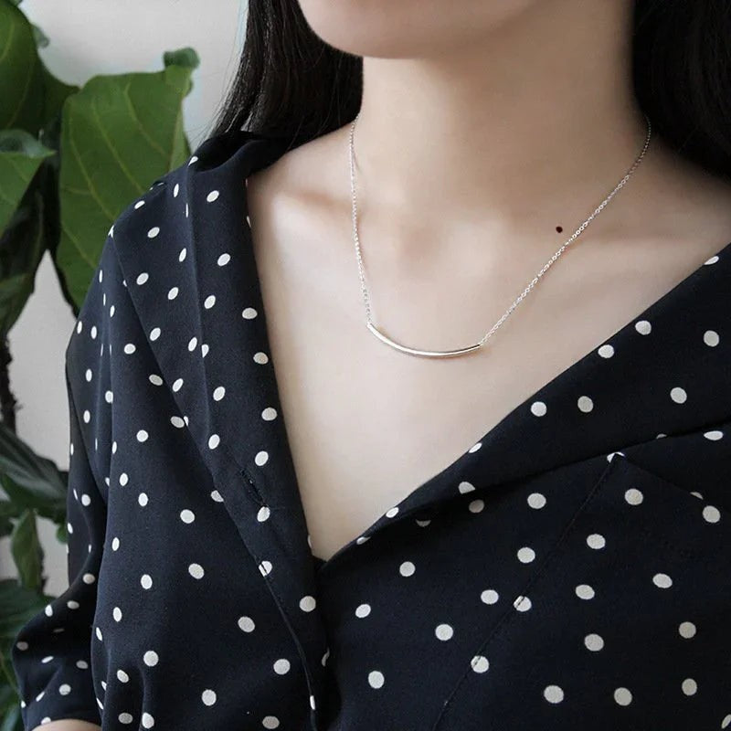 Amara Jewels minimalist 925 sterling silver curved bar necklace with polished silver tone.