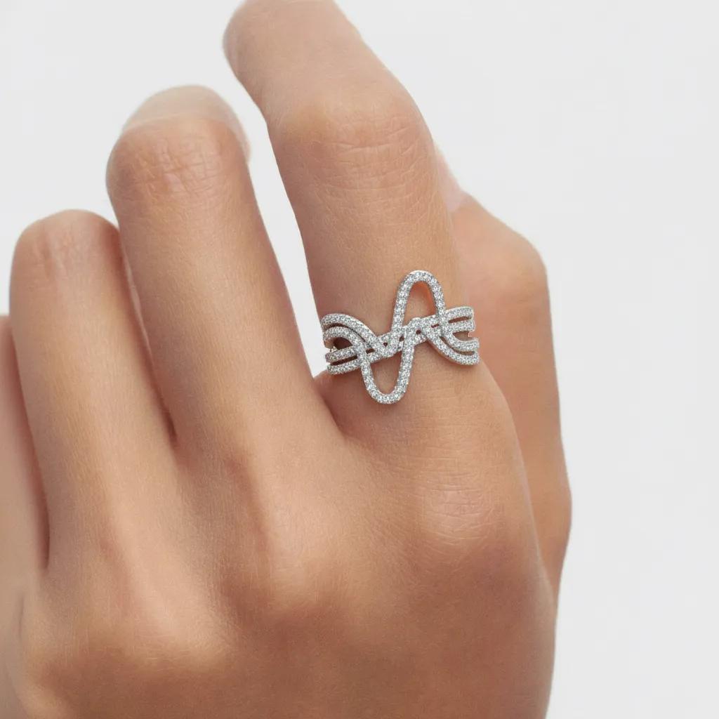 Amara Jewels sterling silver statement ring with cubic zirconia in a curved wave design.