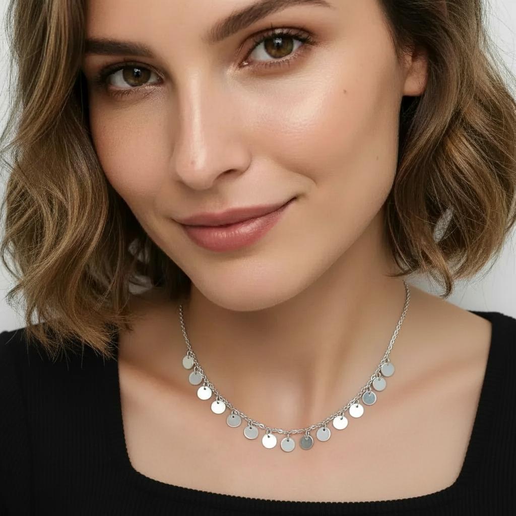 Amara Jewels delicate sterling silver necklace with multiple small disc charms, perfect for everyday wear.