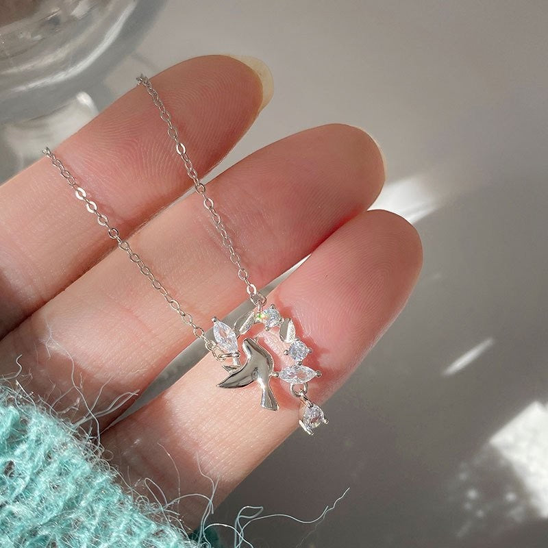 Amara Jewels 925 sterling silver dove pendant necklace with cubic zirconia accents, symbolizing peace and grace.