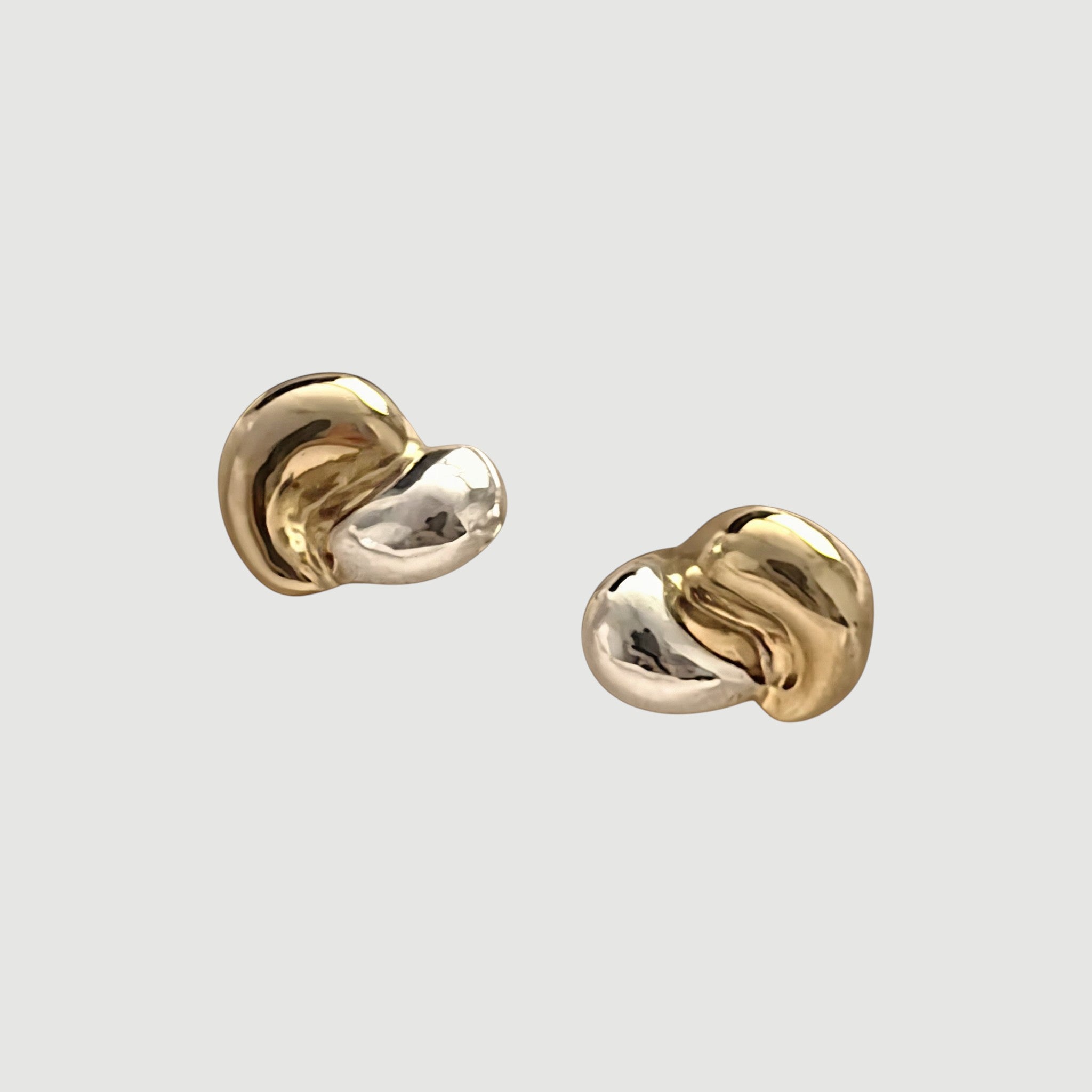 Amara Jewels dual-tone stud earrings in 18K gold-plated sterling silver with organic, fluid shape.